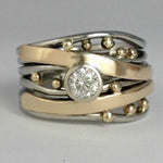 Vintage ring med indlæg af zirkoner og guld