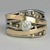 Vintage ring med indlæg af zirkoner og guld