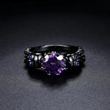 Vintage Czarny Ring med Rund Lilla Ædelsten og Elegant Mønster