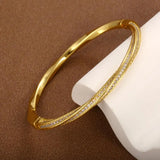 Elegant armbånd med krystaller i to rækker i guld